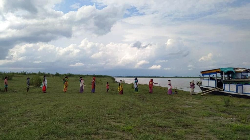 Women and children attend a routine immunisation camp conducted by the boat clinic. This service provides basic health care facilities to the riverine islands on the Brahmaputra river in Assam. Photo from Centre for North East Studies and Policy Research (C-NES).