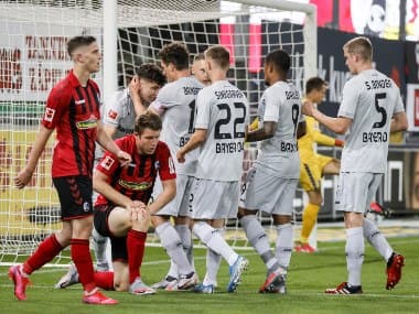 Bayer Leverkusen’s Kai Havertz, left in the background, celebrates with his teammates after scoring a goal during the German Bundesliga match against SC Freiburg. AP