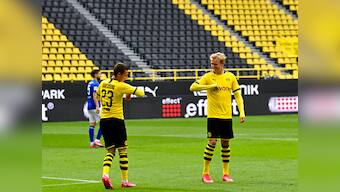 Bundesliga returns with fist-bump celebrations and masks as Borussia Dortmund slam four past Schalke