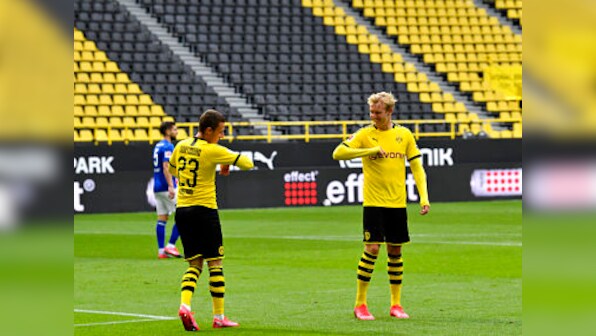 Bundesliga returns with fist-bump celebrations and masks as Borussia Dortmund slam four past Schalke