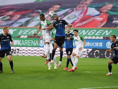 AUGSBURG, GERMANY - MAY 27: Felix Uduokhai (L) of Augsburg jumps for a header with Klaus Gjasula of Paderborn during the Bundesliga match between FC Augsburg and SC Paderborn 07 at WWK-Arena on May 27, 2020 in Augsburg, Germany. (Photo by Matthias Hangst/Getty Images)
