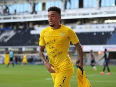 Jadon Sancho of Borussia Dortmund celebrates scoring his team's second goal against Paderborn. AP