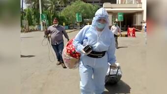 As railways resume train services, passengers eager to get home, arrive ahead of schedule; some don PPE suits to avoid infection