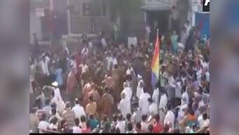 Flouting social distancing guidelines, crowd in Madhya Pradesh's Sagar gathers on street to welcome group of Jain monks