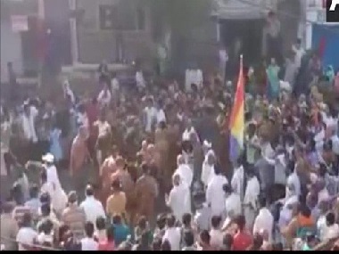 Flouting social distancing guidelines, crowd in Madhya Pradesh's Sagar gathers on street to welcome group of Jain monks Flouting social distancing guidelines, crowd in Madhya Pradesh's Sagar gathers on street to welcome group of Jain monks