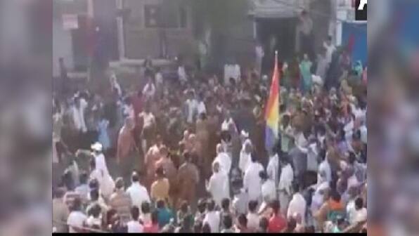 Flouting social distancing guidelines, crowd in Madhya Pradesh's Sagar gathers on street to welcome group of Jain monks
