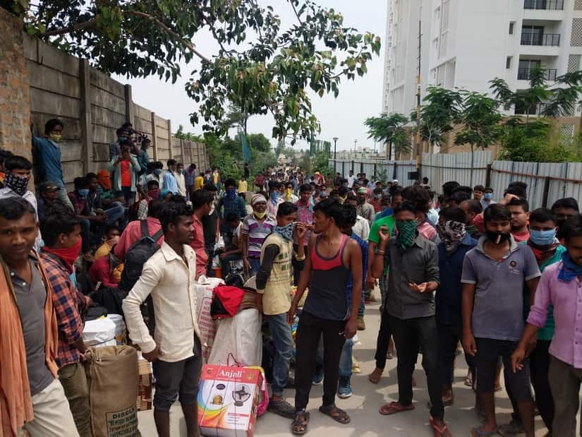 Numerous workers at a construction site at Konankunte Cross demand they be let out of the construction camps to return home. Image courtesy Mohit M Rao