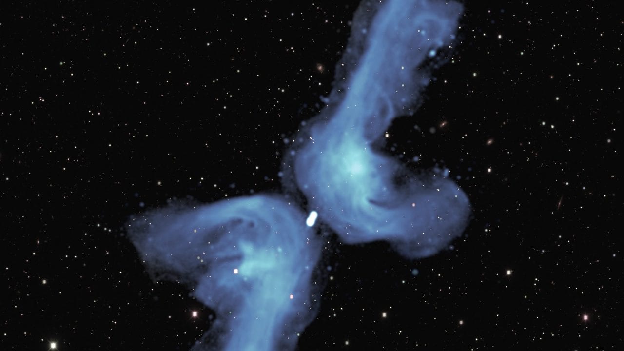The galaxy PKS 2014-55, located 800 million light years from Earth, is classified as ‘X-shaped’ because of its appearance in previous relatively blurry images. The detail provided in this radio image obtained with the MeerKAT telescope indicates that its shape is best described as a ‘double boomerang’. Image credit: NRAO/AUI/NSF; SARAO; DES.