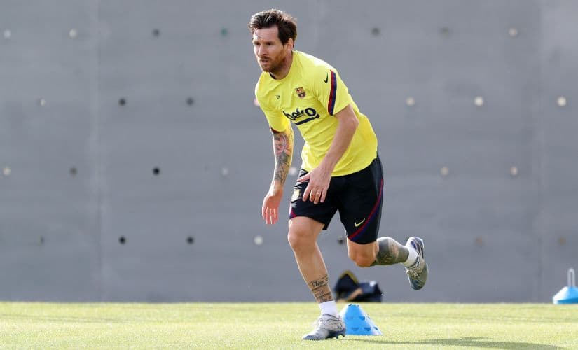 In this photo provided by FC Barcelona, Lionel Messi trains in Barcelona, Spain, on Friday May 8, 2020. Soccer players in Spain returned to train for the first time since the country entered a lockdown nearly two months ago because of the coronavirus pandemic. (Miguel Ruiz/FC Barcelona via AP)