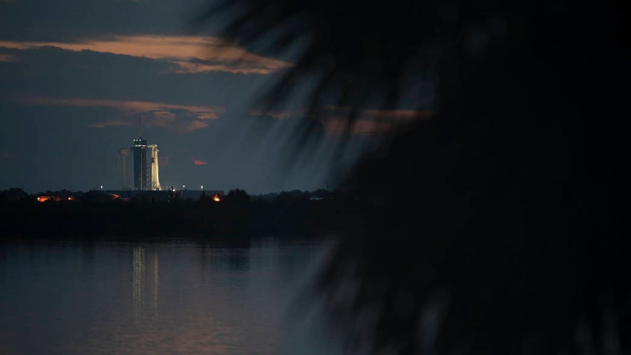 A SpaceX Falcon 9 rocket with the company's Crew Dragon spacecraft onboard is seen on the launch pad at Launch Complex 39A at sunrise as preparations continue for the Demo-2 mission, Wednesday, May 27, 2020, at NASA’s Kennedy Space Center in Florida. NASA’s SpaceX Demo-2 mission is the first launch with astronauts of the SpaceX Crew Dragon spacecraft and Falcon 9 rocket to the International Space Station as part of the agency’s Commercial Crew Program. The test flight serves as an end-to-end demonstration of SpaceX’s crew transportation system. Robert Behnken and Douglas Hurley are scheduled to launch at 4:33 p.m. EDT on Wednesday, May 27, from Launch Complex 39A at the Kennedy Space Center. A new era of human spaceflight is set to begin as American astronauts once again launch on an American rocket from American soil to low-Earth orbit for the first time since the conclusion of the Space Shuttle Program in 2011. Photo Credit: (NASA/Joel Kowsky)