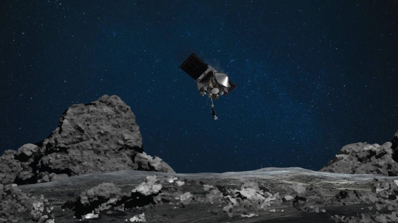 This illustration shows NASA’s OSIRIS-REx spacecraft descending towards asteroid Bennu to collect a sample of the asteroid’s surface. Image Credits: NASA/Goddard/University of Arizona