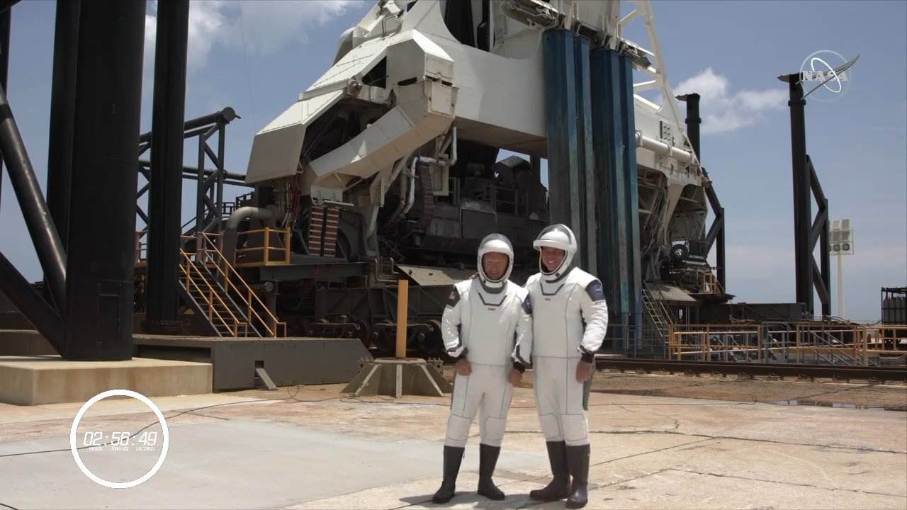 Astronauts Bob Behnken and Doug Hurley stand on the launch pad before they enter the Crew Dragon capsule. Image credit: NASA/Youtube