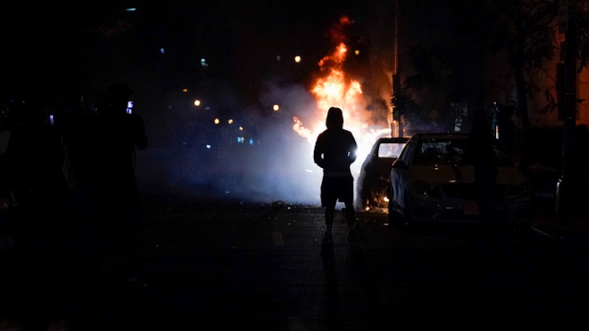 George Floyd death: Protesters set fires near White House, clash with DC police hours before curfew kicks in