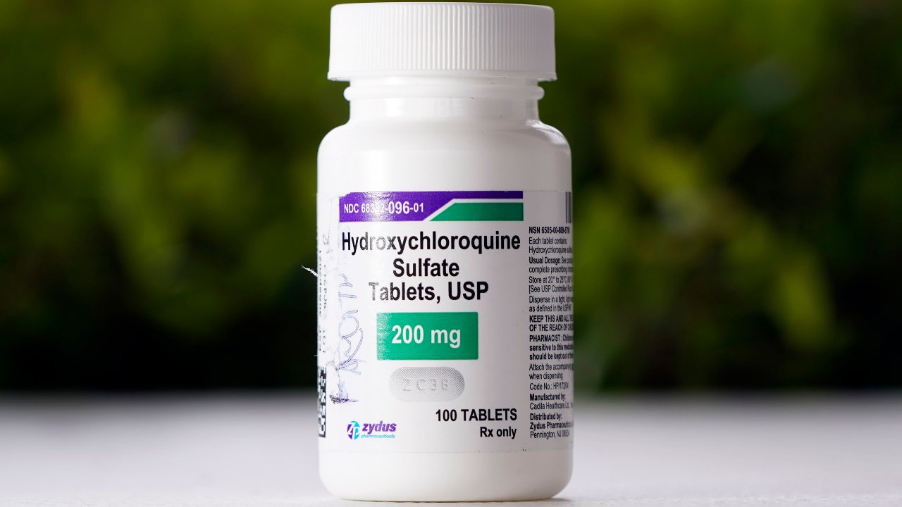 This Tuesday, April 7, 2020 file photo shows a bottle of hydroxychloroquine tablets in Texas City, Texas. The World Health Organization said Monday May 25, 2020, that it will temporarily drop hydroxychloroquine from its global study into experimental COVID-19 treatments because its experts need to review all available evidence. (AP Photo/David J. Phillip, File)
