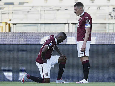 Serie A: Torino's Nicolas Nkoulou takes a knee after scoring against Parma as Italian league resumes Serie A: Torino's Nicolas Nkoulou takes a knee after scoring against Parma as Italian league resumes