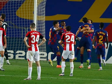 Barcelona's Ivan Rakitic,celebrates with teammates after scoring against Athletic Bilbao. AP