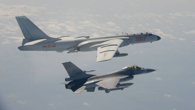 In an image provided by Taiwan’s Ministry of National Defence, a Chinese H-6 bomber flying alongside a Taiwanese F-16 on 10 February. Taiwan Ministry of National Defence via The New York Times