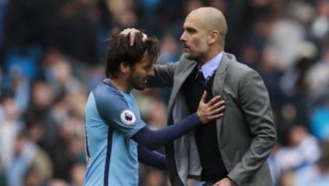 File mage of Manchester City&rsquo;s David Silva with manager Pep Guardiola. 