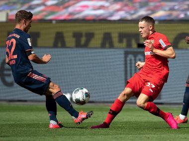 Bayer Leverkusen's Florian Wirtz (R) in action against Bayern Munich. AP
