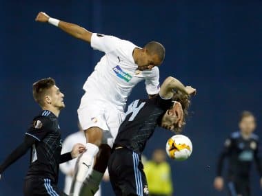 In this file picture from 2019, Plzen player Jean-David Beauguel, center, jumps for the ball with Dinamo Zagreb's Amer Gojak, right, during a Europa League match. AP