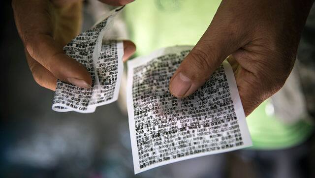 File image of Lee Min-bok, a North Korean defector, with two of his leaflets criticising the North’s government, printed on thin plastic. By Jean Chung © 2020 The New York Times