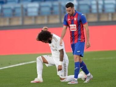Real Madrid's Marcelo takes a knee as he celebrates his goal against Eibar. AP
