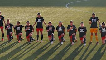 Players in USA's National Women's Soccer League kneel during the national anthem, don Black Lives Matter T-shirts