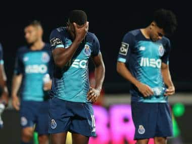Porto's Wilson Manafa reacts at the end of the Portuguese League soccer match between FC Famalicao and FC Porto in Famalicao, Portugal, Wednesday, June 3, 2020. The Portuguese League soccer matches resumed Wednesday without spectators because of the coronavirus pandemic. Porto lost 2-1. (Jose Coelho/Pool via AP)