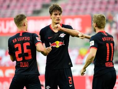 Leipzig's Czech forward Patrik Schick, center, celebrates with teammates Leipzig's Spanish midfielder Dani Olmo, left, and Leipzig's German forward Timo Werner 