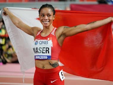 Salwa Eid Naser, of Bahrain, celebrates after winning gold in the women's 400 meter final at the World Athletics Championships in Doha, Qatar, Thursday, Oct. 3, 2019. (AP Photo/David J. Phillip)
