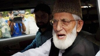 Syed Ali Shah Geelani, face of Kashmiri separatist politics, buried in quiet, pre-dawn funeral