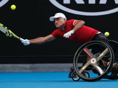 France’s Stephane Houdet reaches for a forehand return to Japan’s Shingo Kunieda in the men’s wheelchair final at the Australian Open tennis championships in Melbourne, Australia, Saturday, Jan. 27, 2018. (AP Photo/Vincent Thian)