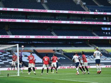 Manchester United's goalkeeper David de Gea clears the ball during the English Premier League soccer match between Tottenham Hotspur and Manchester United at Tottenham Hotspur Stadium in London, England, Friday, June 19, 2020. (AP Photo/Glyn Kirk, Pool)