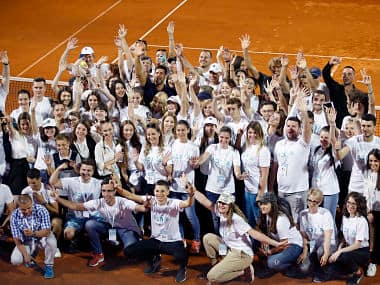  Novak Djokovic, centre, poses with volunteers and players during the Adria Tour charity tournament in Belgrade, Serbia. AP Photo