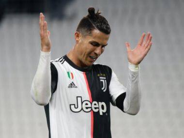 Juventus' Cristiano Ronaldo reacts during an Italian Cup second leg soccer match between Juventus and AC Milan at the Allianz stadium, in Turin, Italy, Friday, June 12, 2020. The match was being played without spectators because of the coronavirus lockdown. (AP Photo/Luca Bruno)