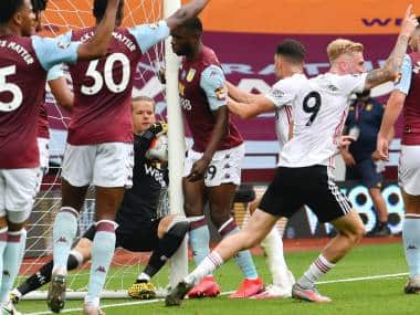 Aston Villa's Oerjan Nyland saves inside the net during the English Premier League soccer match between Aston Villa and Sheffield United at Villa Park in Birmingham, England, Wednesday, June 17, 2020. The English Premier League resumes Wednesday after its three-month suspension because of the coronavirus outbreak. (Paul Ellis/Pool via AP)