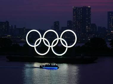 The Olympic rings float in the water at sunset in the Odaiba section of Wednesday, June 3, 2020, in Tokyo. Tokyo issued a coronavirus alert yesterday for the Japanese capital amid fear of a resurgence of the infections only a week after a state of emergency was lifted. (AP Photo/Eugene Hoshiko)