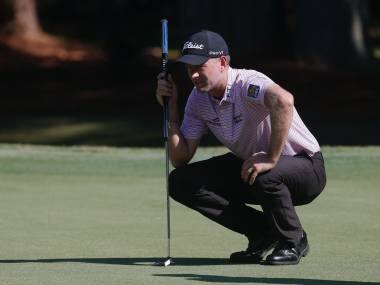 Webb Simpson lines up his putt on the first green, during the second round of the RBC Heritage golf tournament, Friday, June 19, 2020, in Hilton Head Island, S.C. (AP Photo/Gerry Broome)