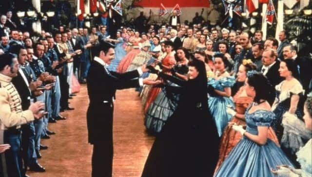Scarlett, still mourning the death of her first husband Charles, dancing with Rhett at a charity ball. Image via Facebook