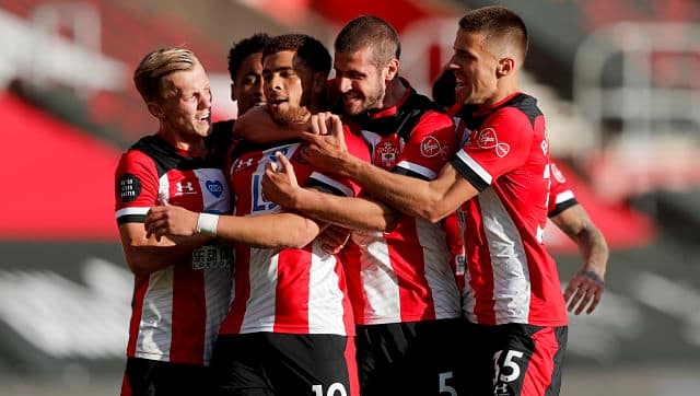 Southampton's Che Adams is congratulated by teammates after scoring his team's goal against Manchester City. AP