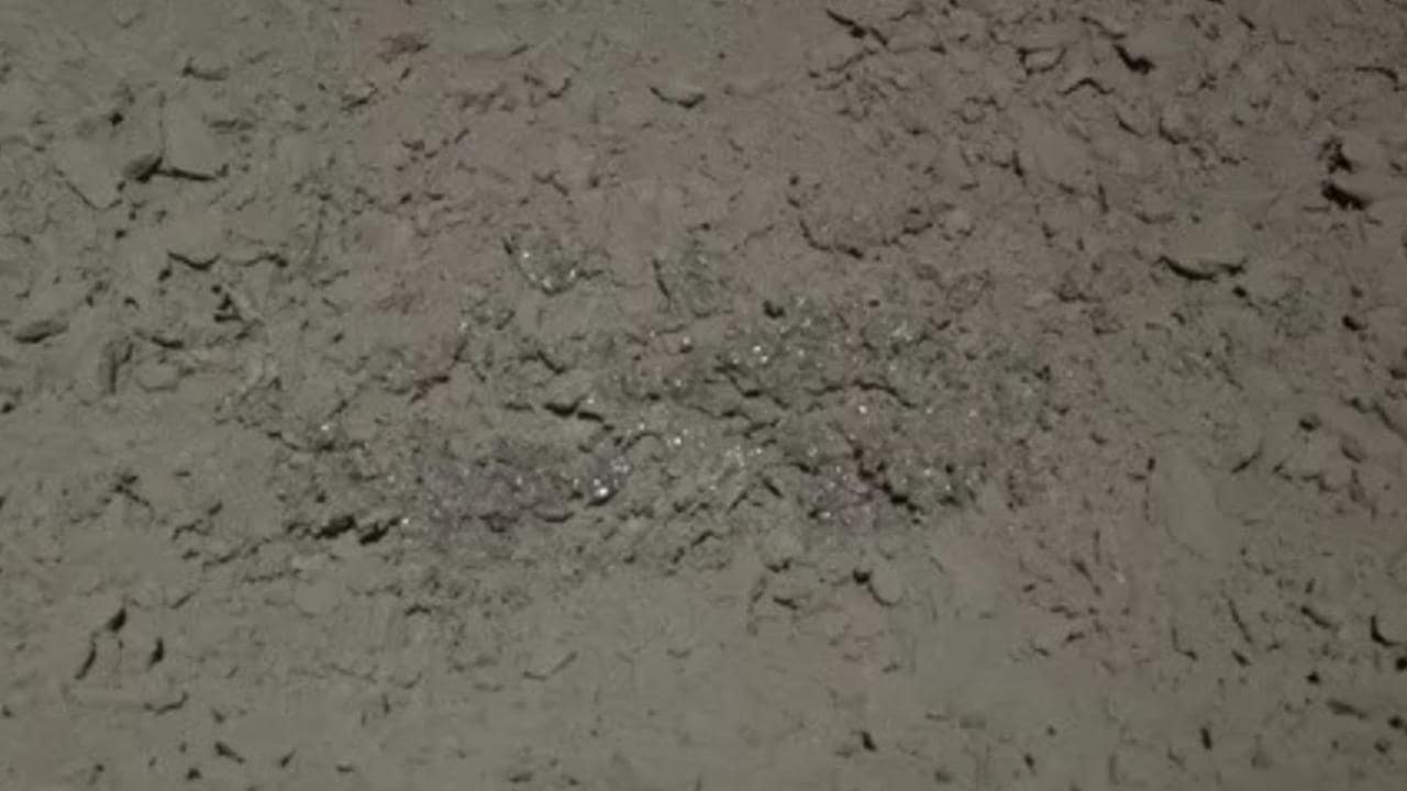 China's Yutu 2 moon rover captured this image of glassy material from the edge of a small crater. Image courtesy: CNSA/CLEP