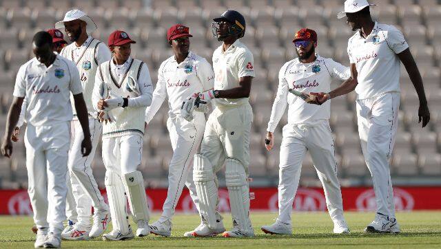 England’s Jofra Archer departs the field with West Indian players at the end of play on the fourth day. AP