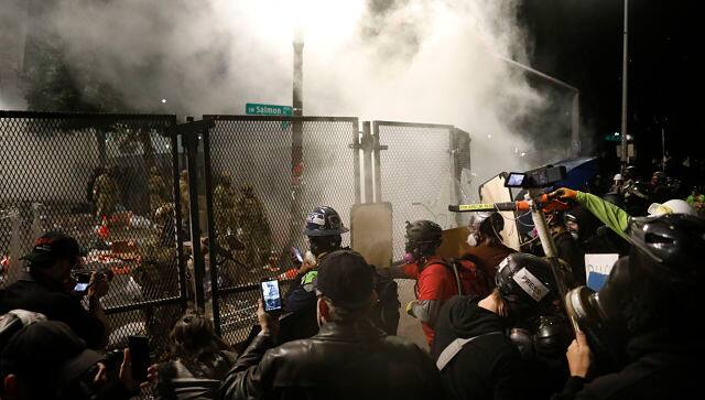 Federal agents tear-gas protesters near the Mark O Hatfield Courthouse in Portland last week. By Octavio Jones © 2020 The New York Times