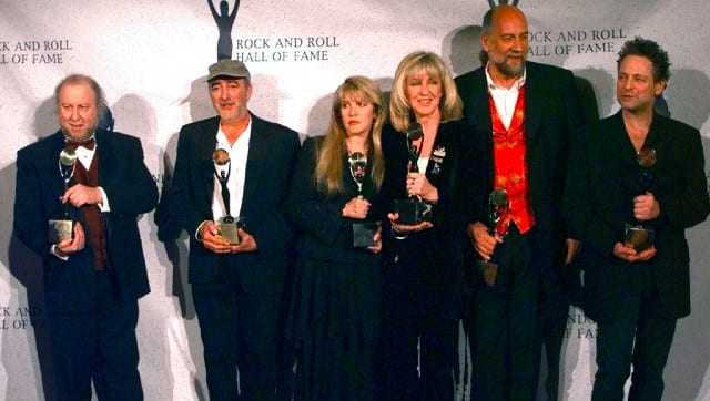 Members of Fleetwood Mac hold their awards after the group was inducted into the Rock and Roll Hall of Fame, in New York in 11998. From left, are: Peter Green; John McVie; Stevie Nicks; Christine McVie; Mick Fleetwood; and Lindsey Buckingham. AP
