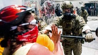 US charges 18 Portland protesters with arson, trespassing as it sends tactical police to Seattle