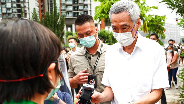 Singapore PM Lee Hsien Loong returns to power with clear mandate, but ruling party's popular vote dips to 61% Singapore PM Lee Hsien Loong returns to power with clear mandate, but ruling party's popular vote dips to 61%