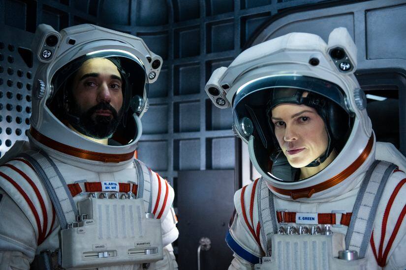 Ray Panthaki and Hilary Swank in Away. Image from Netflix