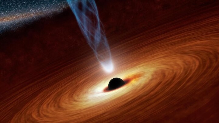Scientists discover a huge black hole, 700 million light-years away, that eats about one sun per day