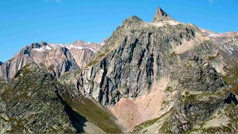 Glacial ice on Italy's Alps turns a shade of pink due to algae, leads to concerns of melting
