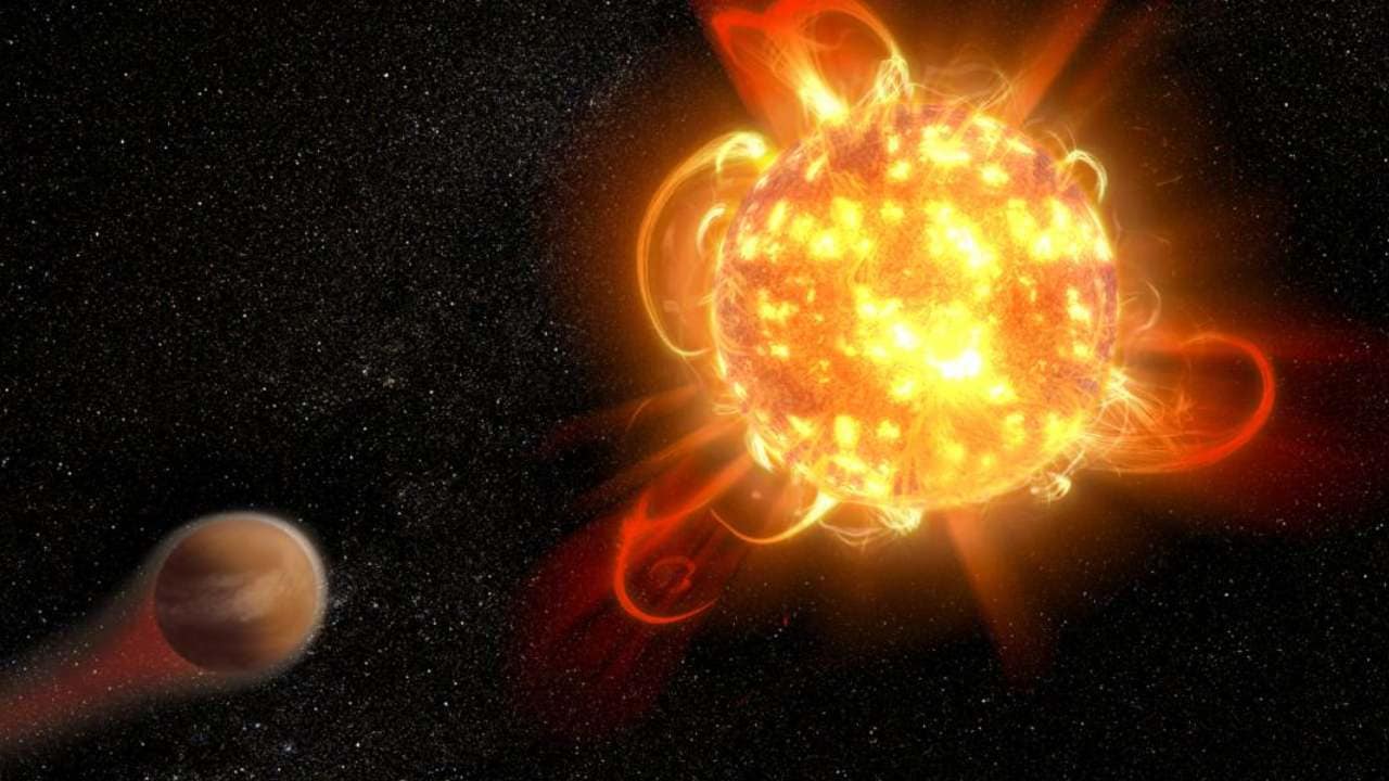 An artist's depiction of a superflare on an alien star. Image Credit: NASA, ESA and D. Player